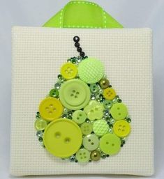 a green and white bag with buttons on it