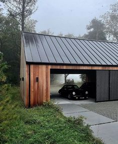 a car is parked in the garage with its door open to reveal it's own driveway