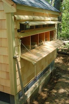 a chicken coop built into the side of a house