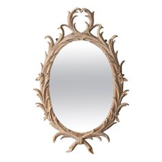 an oval mirror with leaves and scrolls on the edges, hanging from a wall or ceiling