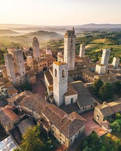 an aerial view of a village with tall towers