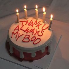 a birthday cake with candles on it that says thank u always my boo written in red