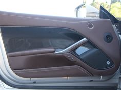 the interior of a car with its door open