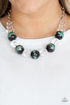 A collection of shiny black and glassy clear beads are threaded along an invisible wire below the collar. The black beads are splashed in hints of refreshing green and shiny metallic paint for a colorful finish. Features an adjustable clasp closure.

Sold as one individual necklace. Includes one pair of matching earrings. Clear Beads, Trendy Necklaces, Paparazzi Accessories, Rings Bracelets, Earrings Rings, Affordable Jewelry, Paparazzi Jewelry, Green Necklace, Jewelry Business