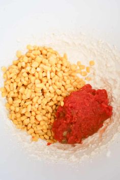 corn and red sauce in a white bowl