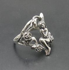 Sterling silver ring 925/1000, fairy and flower. Stamped 925. Approximate weight 8.5 grams. Top width 2.4cm. All our jewels are made from solid sterling silver 925/1000 and are carefully crafted by hand in our family workshop. We dispatch your orders in 5 working days, worldwide and the postage is $5. We ship registered priority mail. Please allow 5-7 working days for delivery in Europe and 10-15 working days outside Europe. For any questions - please do not hesitate to contact me! Sterling Silver Fairycore Jewelry, Fairycore Sterling Silver Jewelry In Silver, Fairycore Sterling Silver Jewelry, Fairy Style Sterling Silver Jewelry, Fairies Photos, Figural Jewelry, Flower Rose, Fairy Wings, Bulgaria