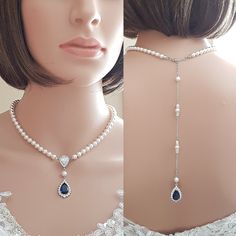 The Aoi pearl wedding back necklace is a great selection if you are looking for blue bridal jewelry. I have made it with a beautiful teardrop blue sapphire crystal cubic zirconia drop which is accented with tiny clear cz crystals around it to form the pendant drop in front. I have completed it with the soft color of 6mm round crystal pearls strung onto a teardrop central zirconia bead. The pearl necklace is finished off with a rhodium plated brass clasp. The backdrop pearl bridal necklace also h Blue Bridal Jewelry, Elegant Sapphire Wedding Necklace, Elegant Sapphire Bridal Necklace For Wedding, Blue Pearl Drop Necklace For Wedding, Elegant Blue Sapphire Bridal Necklace, Formal Sapphire Crystal Bridal Necklace