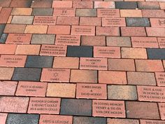 bricks with names on them are arranged in rows