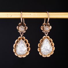 An incredible pair of earrings, perfect for that special day, and every day! A pair of larger rose pear shaped diamonds take center stage here, in their original foil backings in excellent shape (no discoloration, etc). The earrings appear to have been converted or perhaps re-imagined from another antique jewel but maintains all its charm! Hangs on the lobes at the perfect length. 14kt yellow gold, with the upper portion in 10kt as well as the ear wires Pear Diamonds are etimated to be J/K color Modern Mens Rings, Art Jewelry Earrings, Pear Earrings, Bezel Earrings, Antique Watches, Antique Engagement, Pear Diamond, Pear Shaped Diamond, Vintage Band