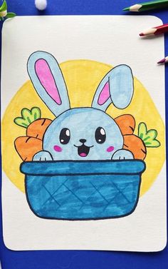 a drawing of a bunny in a basket with carrots