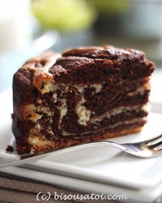 a piece of chocolate cake on a plate with a fork