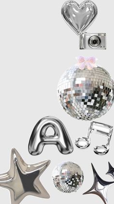 an assortment of shiny objects including a mirror ball, star, camera and other items