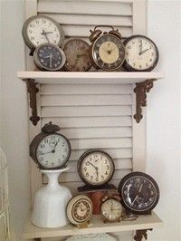 there are many different clocks on the shelf