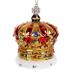 a gold crown ornament on a white background