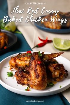 chicken wings on a white plate with limes and red peppers in the background, text reads easy recipes that red curry baked chicken wings