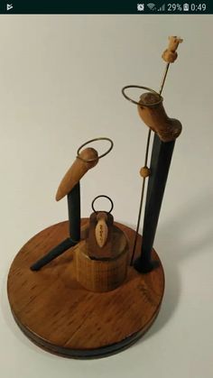 a wooden stand with metal objects on it