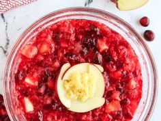 an apple and cranberry dessert in a bowl