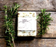 rosemary soap bar sitting on top of a wooden table