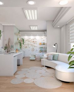 a living room filled with white furniture and lots of greenery on the wall next to a kitchen