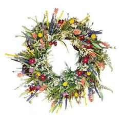 a wreath with flowers and greenery on it