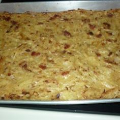 a casserole dish is sitting on top of the stove and ready to be baked