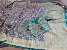 Blouse stitched - Yes Blouse Opening - Front Sleeves Length - Elbow Padded - No Blouse size - 34 with inner margins expandable upto 40 For Blouse Size 32 alteration can be done on request. Fall/pico - Yes done Green Banarasi Silk Blouse With Motifs, Green Banarasi Silk Long Sleeve Blouse, Green Long Sleeve Banarasi Silk Blouse, Green Art Silk Blouse With Traditional Patterns, Multicolor Long Sleeve Art Silk Blouse Piece, Semi-stitched Long Sleeve Saree With Motifs, Fitted Multicolor Katan Silk Blouse Piece, Green Blouse With Zari Weaving For Traditional Ceremonies, Green Blouse With Traditional Patterns And Drape