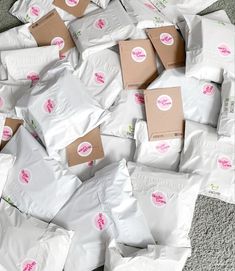 a pile of white bags sitting on top of a carpet