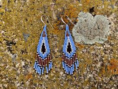 Statement earrings for powerful womxn. Send your climbs, summit your peaks, and take up your unique space in the outdoors. These stunning, hand stitched beaded earrings in a Southwestern theme will empower you on your next adventure. These sophisticated dangle earrings will empower you to feel beautiful wherever you go. The color scheme is inspired by the colors of the desert at twilight. Ear wires are gold-plated, silver, or copper. Please specify the type of metal you would like when ordering. Southwestern Handwoven Blue Jewelry, Blue Southwestern Beaded Fringe Earrings, Southwestern Blue Beaded Fringe Earrings, Artisan Blue Earrings With Beaded Fringe, Southwest Chic, Beaded Fringe Earrings, Seed Bead Patterns, Beading Techniques, Feel Beautiful