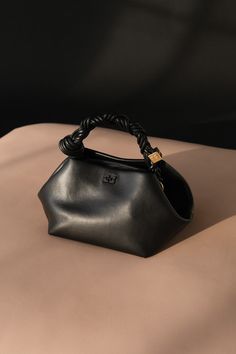 Iconic Handbags Designer Bags, Ganni Bou Bag Outfit, Leau Papier, Ganni Bou Bag, Best Everyday Handbag, Ganni Bag, Bag Closet, Butterfly Logo, Everyday Handbag