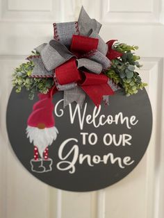 welcome to our gnome door hanger on the front door with red and gray bow