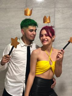 a man and woman dressed up in costumes