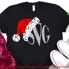 a t - shirt with the word svg on it next to some shoes and a pair of sneakers