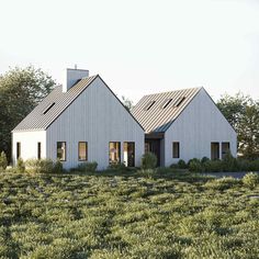 two white houses in the middle of a field