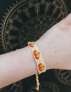 An adjustable pumpkin, fall inspired bracelet. All hand made by yours truly. Fits all. Adjustable Orange Bohemian Friendship Bracelet, Adjustable Orange Bohemian Braided Bracelet, Orange Bohemian Braided Bracelets For Friendship, Handmade Orange Braided Bracelets In Bohemian Style, Adjustable Orange Beaded Braided Bracelet, Orange Handmade Bohemian Braided Bracelets, Handmade Bohemian Orange Braided Bracelet, Handmade Orange Bohemian Braided Bracelet, Bohemian Orange Friendship Bracelets As Gift