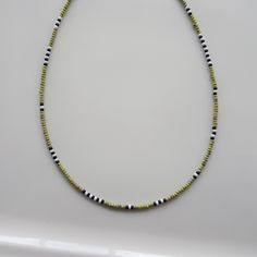 Green miyuki beads, black miyuki beads, and white miyuki beads are used in this Mens Beaded Necklace. Each Beaded Choker consists of 2.8mm - 3mm i.e. 8/0 beads. I used all Surfer Necklace, Mens Beaded Jewelry stainless steel wire and silver plated lobster claw. mens jewelrymen giftsmens necklacebest man giftsfor himboyfriend necklacenecklaces for menbeaded jewelrysurfer necklacebeaded chokerbohemian necklacehandmade necklacesmens beaded necklace Black And Silver Beaded Necklace, Beaded Necklace Designs For Men, Men Beaded Necklace Ideas, Black Heishi Beads For Beach, Black Beaded Necklaces With Spacer Beads For Beach, Black Beaded Necklaces For Beach, Handmade Black Heishi Beads, Black Heishi Beaded Necklaces, Black Beaded Necklace With Letter Beads