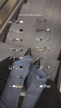 someone is standing on an escalator with their feet in the air and there are many pins stuck to them