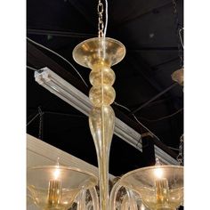 a glass chandelier hanging from the ceiling