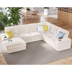 a large white sectional couch in a living room