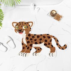 an image of a sticker of a leopard on a table next to scissors and other items