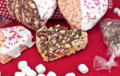 there are many different types of treats on the table with white and pink sprinkles