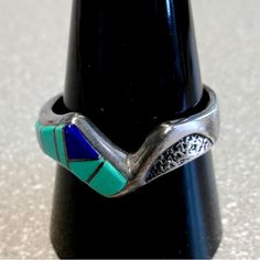 Pretty Zuni Native American Ring, Delicate Detailed Design With Turquoise,Lapis And Tufa Casting Work On One Side Of The Inlay. Handcrafted, Unique Ring. Size 11 1/4 Weight 5.93 Grams Sterling Silver Condition New, Never Worn,From Vintage 1980's Collection. Blue Multi-stone Turquoise Ring In Sterling Silver, Adjustable Blue Multi-stone Rings, Adjustable Multi-stone Blue Rings, Adjustable Silver Turquoise Multi-stone Ring, Adjustable Multi-stone Turquoise Ring In Silver, Adjustable Multi-stone Silver Turquoise Ring, Southwestern Style Blue Hallmarked Jewelry, Modernist Blue Gemstone Jewelry, Blue Turquoise Sterling Silver Ring With Stones