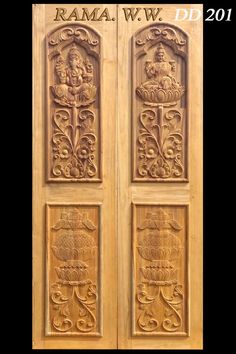 carved wooden doors with carvings on them