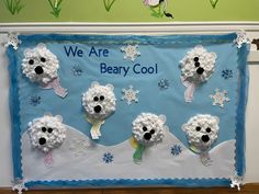 there is a polar bear bulletin board with snowflakes on it and bears in the background