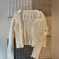 Altard State Cream Crochet Knit Cardigan Cropped Button Up Grandma Core Nwt Sweater Ivory Nwt Excellent Condition! No Signs Of Wear. Super Soft Cropped Lightweight Cardigan. Cottage/Grandma Core. 60% Cotton 40% Acrylic. Please See Pics For Approximate Measurements, Comes From A Smoke Free Pet Friendly Home. Send An Offer! :) Such A Steal Cottage Grandma, Green Oversized Sweater, Lace Trim Sweater, Black Duster, Grandma Core, Coral Sweater, Crochet Cardigans, Cardigan Crop, Cute Cardigans