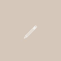 a white pencil on a beige background