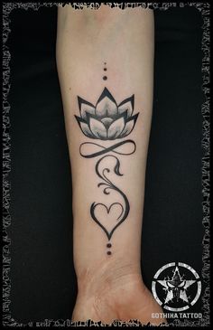 a woman's foot with a lotus tattoo on the left side of her leg