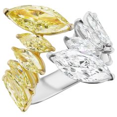 Marquise Shape White and Yellow Diamonds each weighing 2.0 and 2.50 carats respectively. Set with White and Yellow Marquise Shaped Diamonds weighing 2.40 carats. Set in Platinum and 18 Karat Rose Gold. Female Rings, Pear Shaped Diamond Ring, Contemporary Engagement Rings, Marquise Diamond Ring, Marquise Shape Diamond, Green Tourmaline Ring, Colored Diamond Rings, Yellow Diamonds, White Diamond Ring