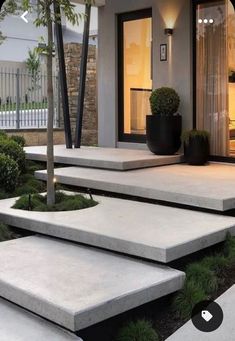 concrete steps leading to the front door of a house