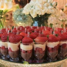 desserts with strawberries are arranged on a platter