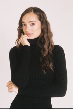 A fall staple - a classic black turtleneck dress that is both sleek and refined. Black Turtleneck For Fall Workwear, Black Turtleneck For Workwear In Fall, Fitted Black Turtleneck For Fall, Classic Black Turtleneck For Fall, Black High Neck Turtleneck For Work, Chic Black Turtleneck For Layering, Elegant Black Turtleneck For Fall, Sleek Turtleneck For Fall, Elegant Solid High-neck Turtleneck